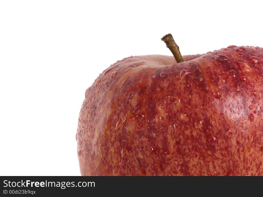 A delicious red apple with waterdrops over 100 % white background. A delicious red apple with waterdrops over 100 % white background.