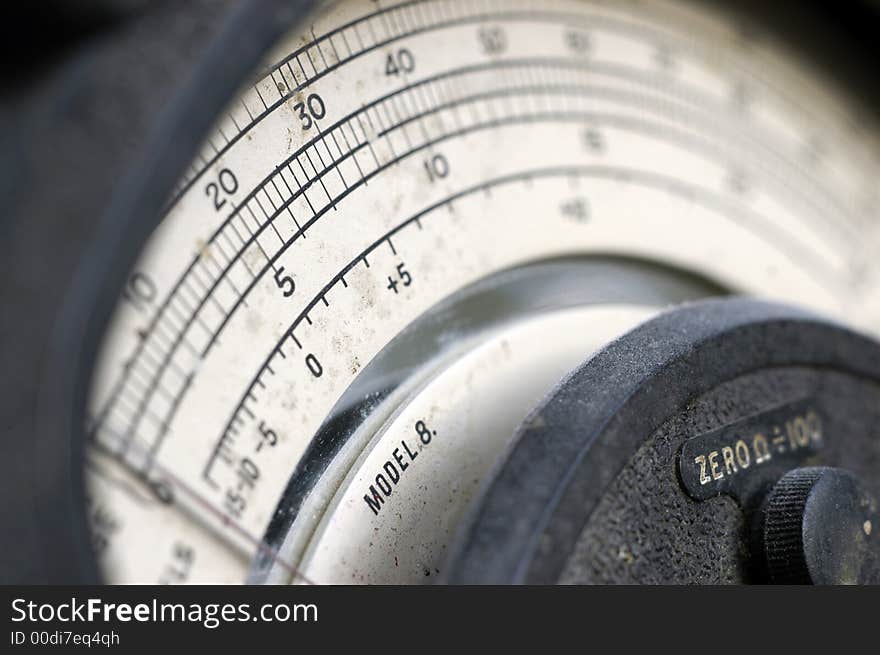 The face and scale of a battered old multimeter from the nineteen fifties. The face and scale of a battered old multimeter from the nineteen fifties