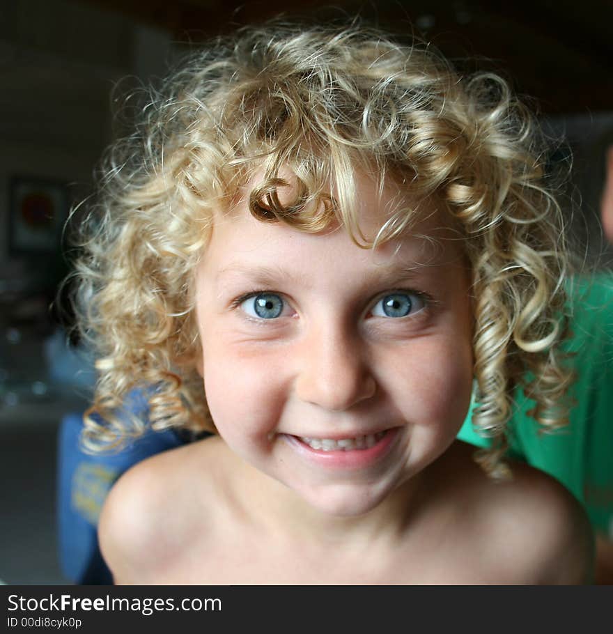 Blue eyed girl playing with her brother. Blue eyed girl playing with her brother