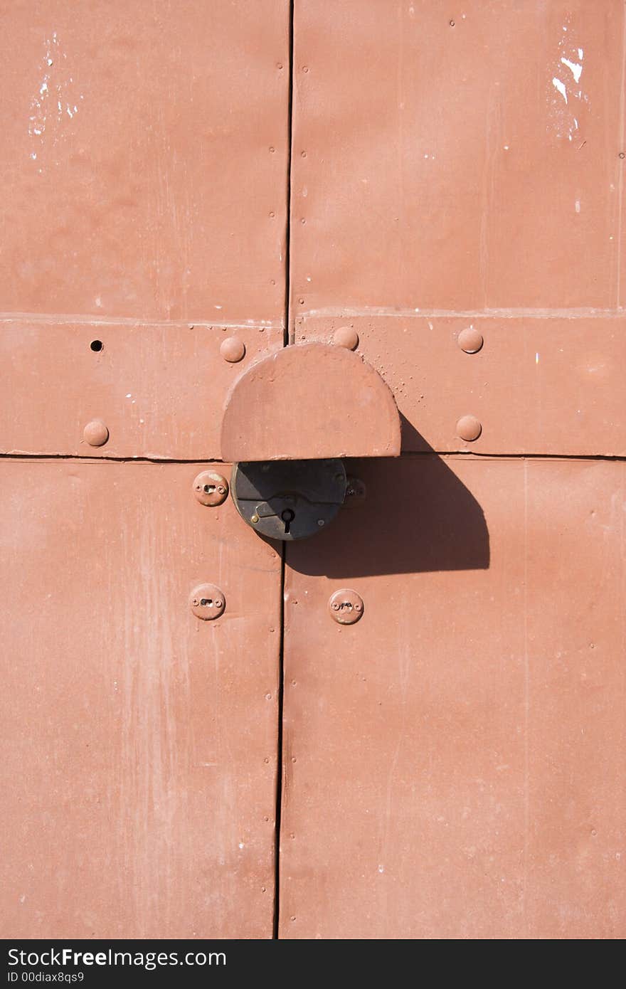 The padlock on metal gate