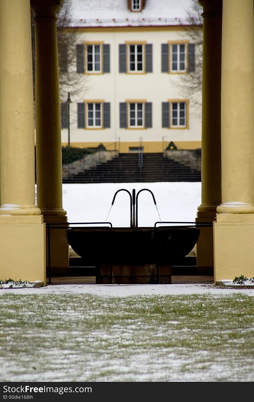 Mineral fountain in an open biedermeier hall with a look in a misty parc. With space for copy. Mineral fountain in an open biedermeier hall with a look in a misty parc. With space for copy.