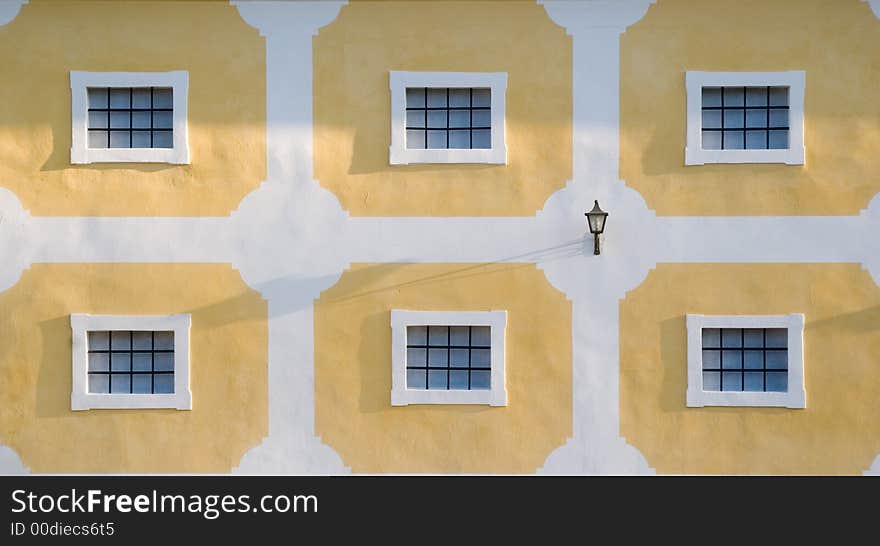 Wall with many windows and one nice lantern. Wall with many windows and one nice lantern