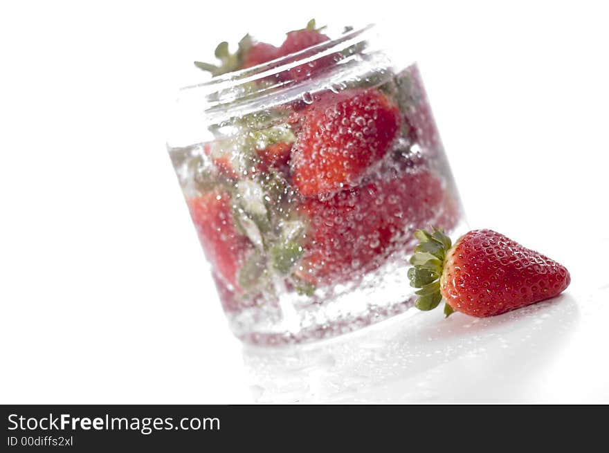 Red beautiful strawberry on the glass