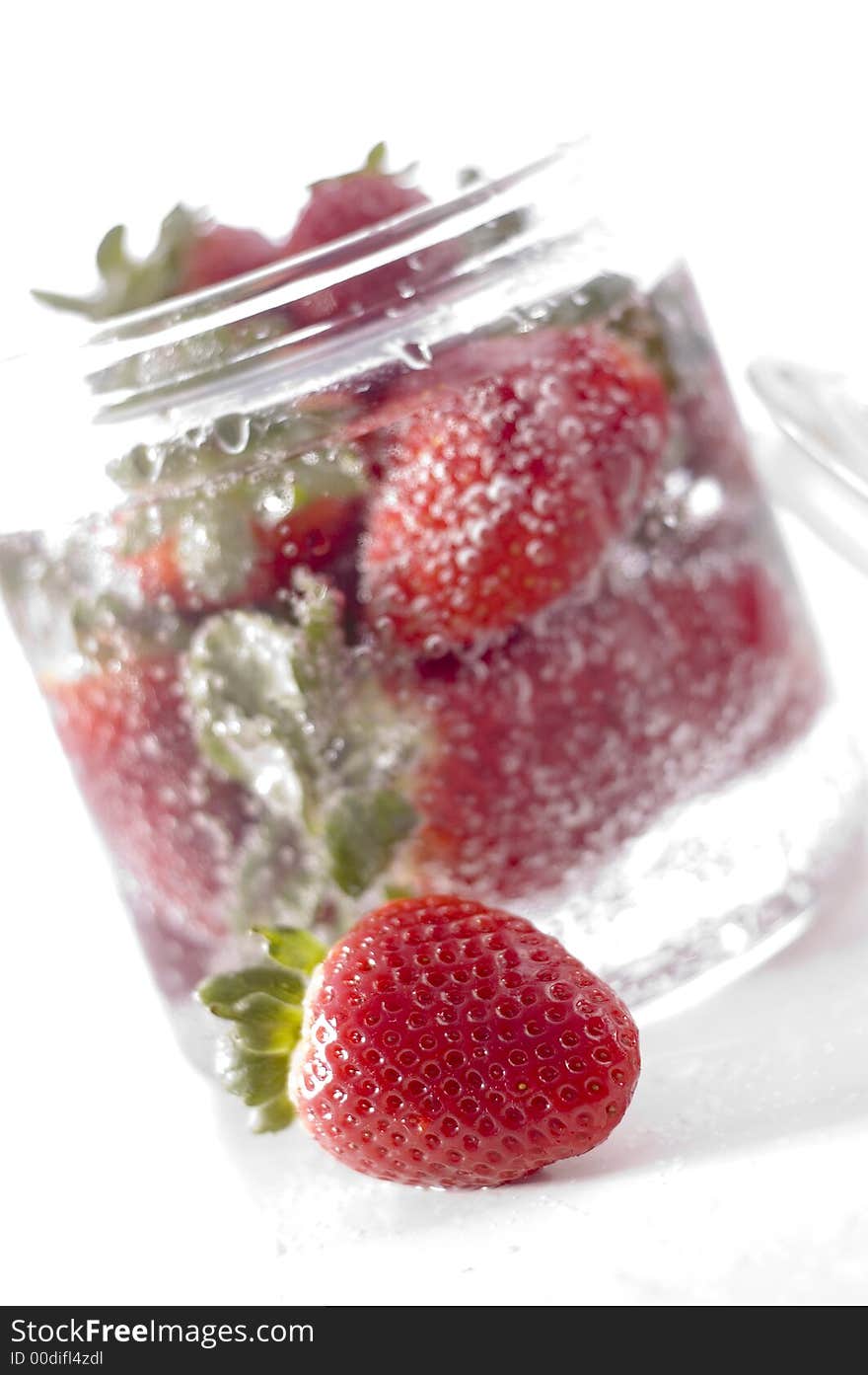 Red beautiful strawberry on the glass