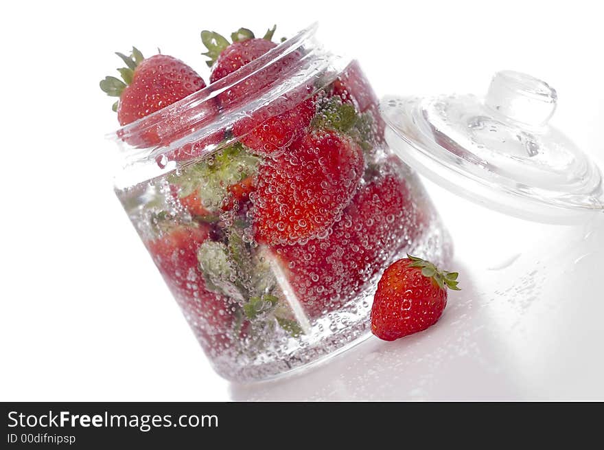 Red beautiful strawberry on the glass