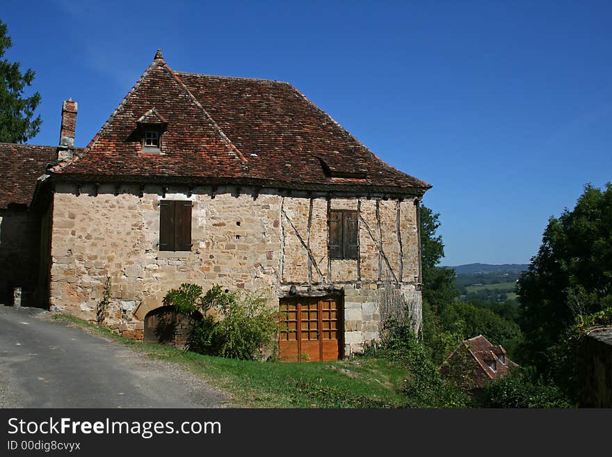 Old barn on side of road, overlooking the scenery. Old barn on side of road, overlooking the scenery