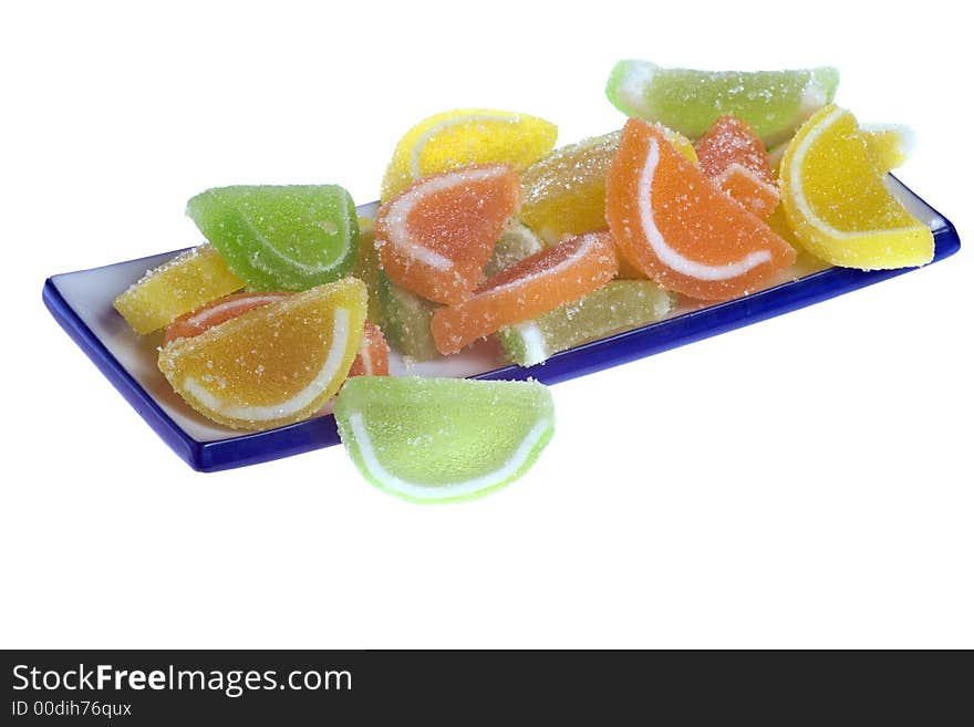 A photo of orange, green and yellow marmalade. A photo of orange, green and yellow marmalade