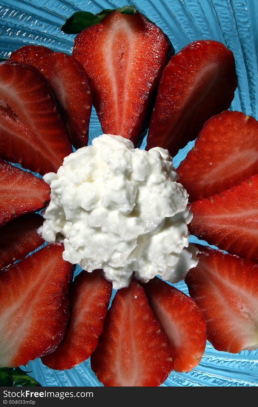 Close-up image of strawberries and cottage cheese on plate. Close-up image of strawberries and cottage cheese on plate