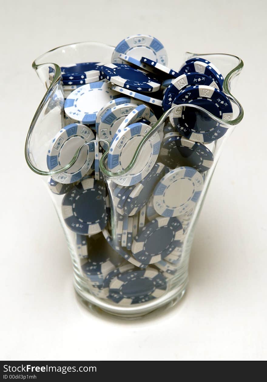 Blue and white Poker Chips in a vase.