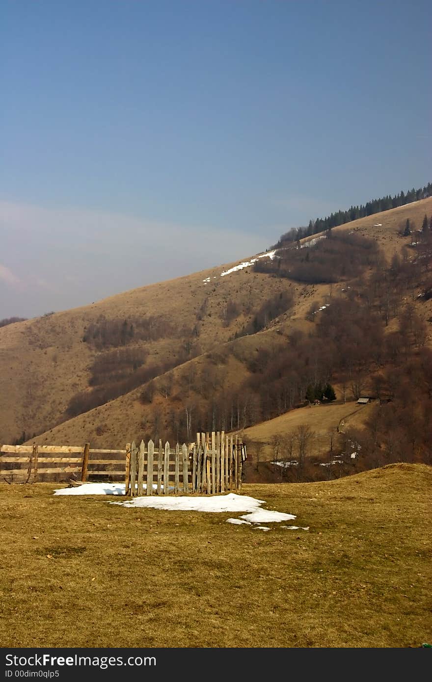 Rural landscape with wood fence in the mountains