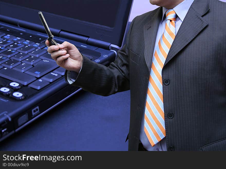 Businessman interacting with his laptop. Businessman interacting with his laptop