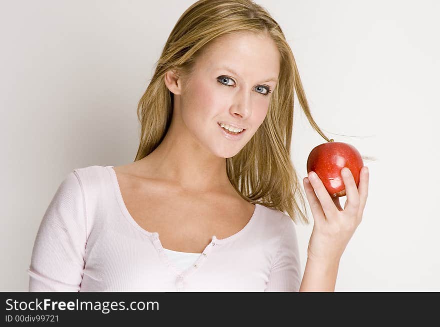 Blond girl and apple