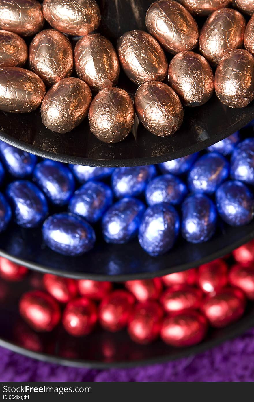 Chocolate easter eggs in a staged bowl color assorted