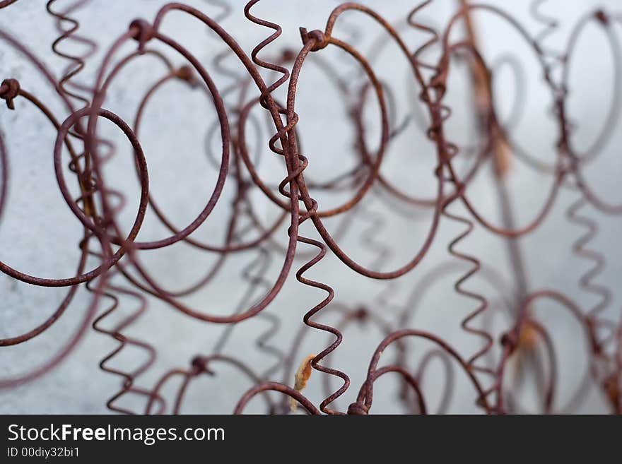 Rusted wire netting from old spring mattress. Rusted wire netting from old spring mattress