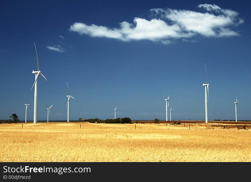 Countryside landscape with wind electricity farm against the backdrop of blue sky and white cloud. Countryside landscape with wind electricity farm against the backdrop of blue sky and white cloud