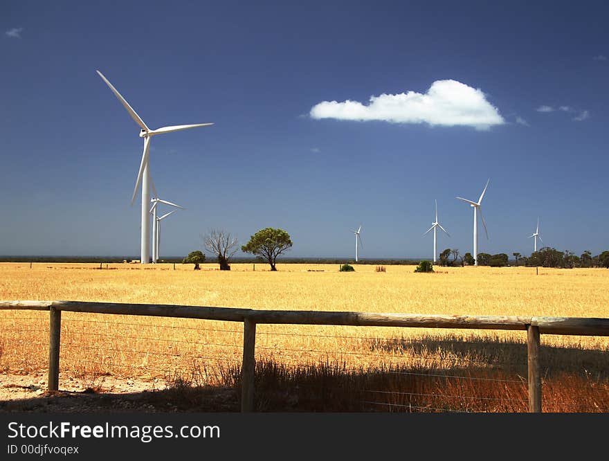 Countryside landscape with wind electricity farm against the backdrop of blue sky and white cloud. Countryside landscape with wind electricity farm against the backdrop of blue sky and white cloud