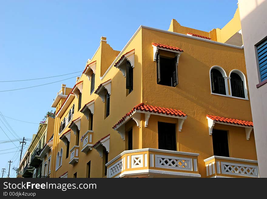 Amber yellow stucco commercial and residential building. Amber yellow stucco commercial and residential building