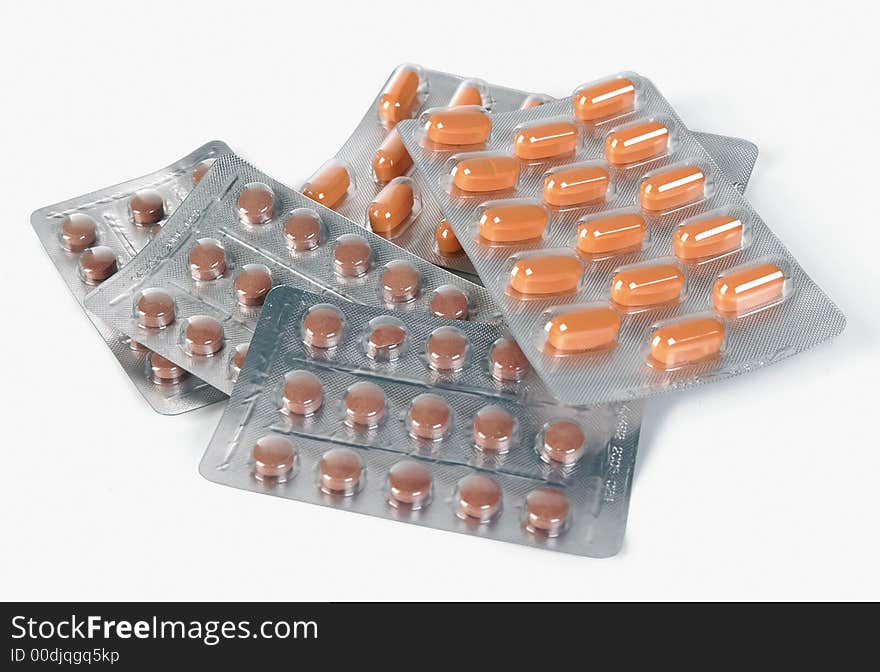 Tablets and pills on white