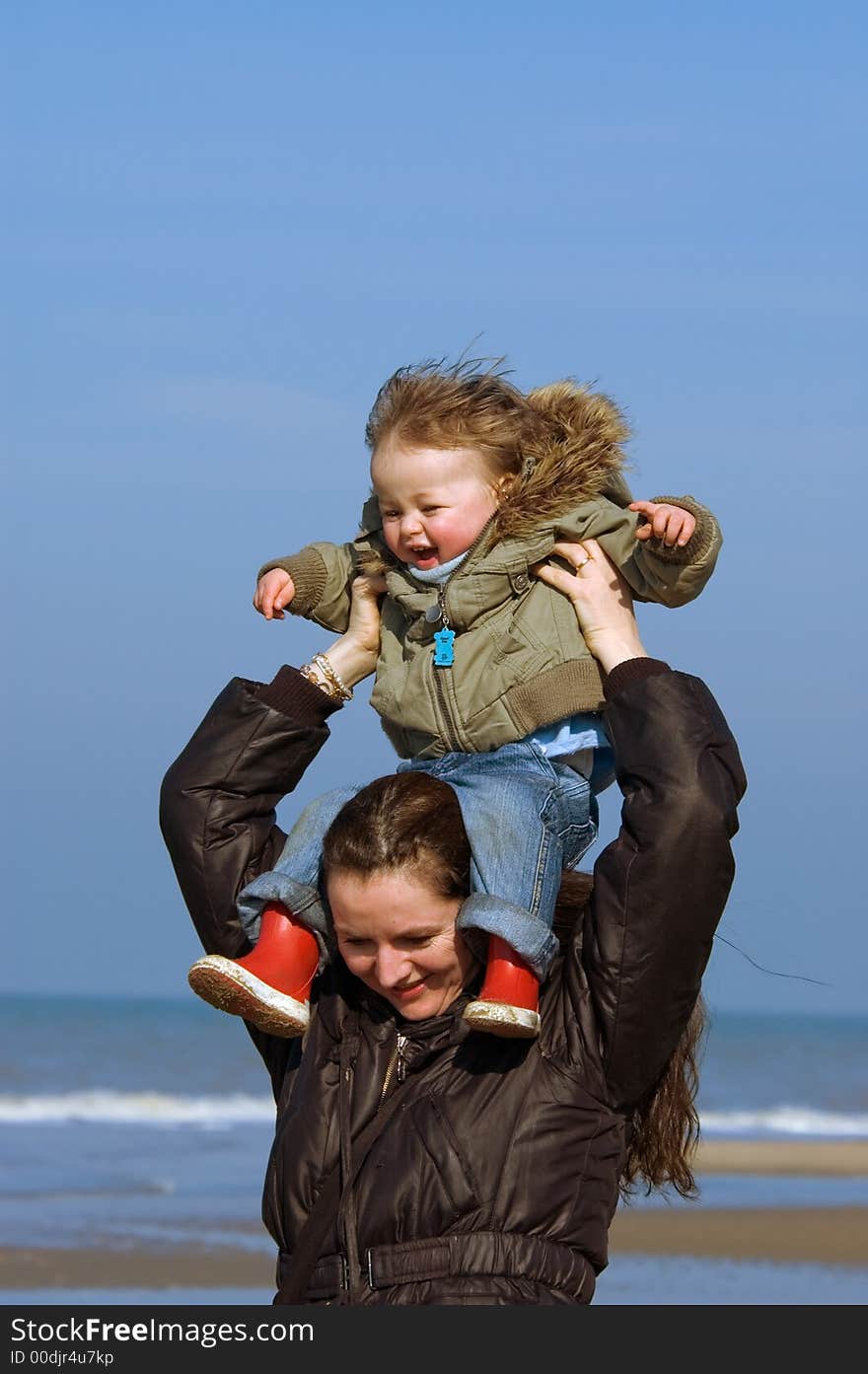 Happy mother with her cute boy having fun on the beach. Happy mother with her cute boy having fun on the beach