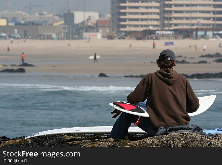 Photo of a surfer with a board. Photo of a surfer with a board