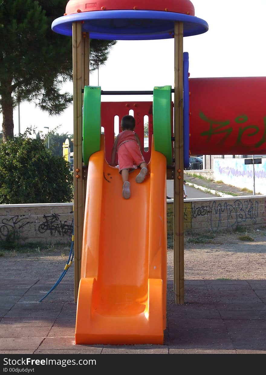 Little boy on sliding board