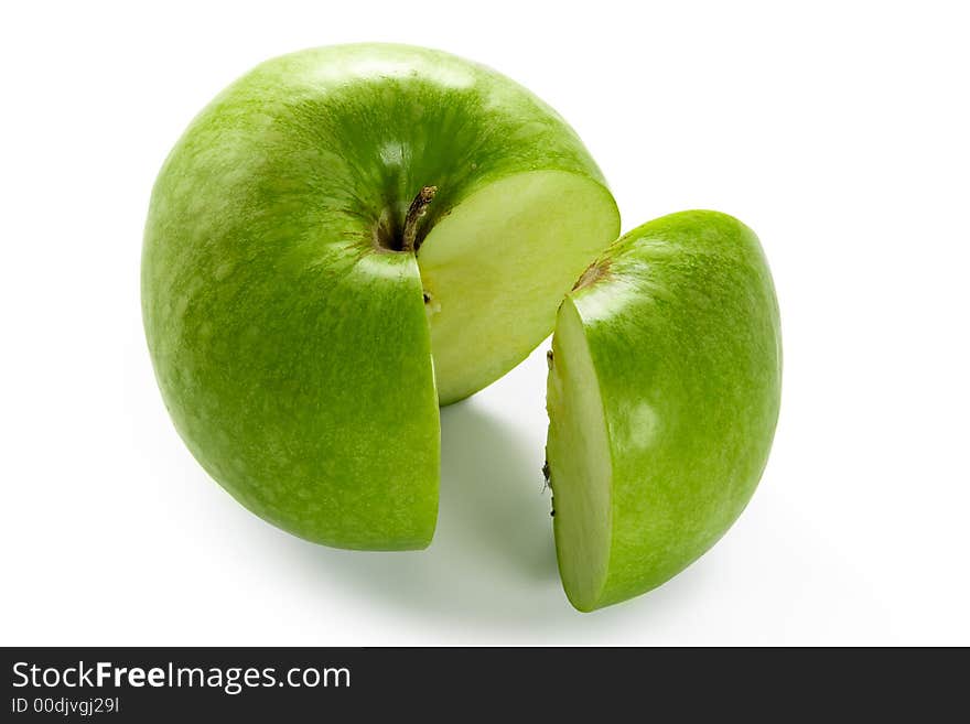 Big green apple with cut out one segment