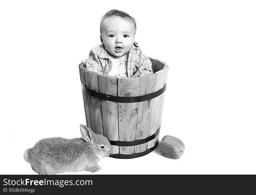 Country life with baby in a bucket and bunnies. Country life with baby in a bucket and bunnies.