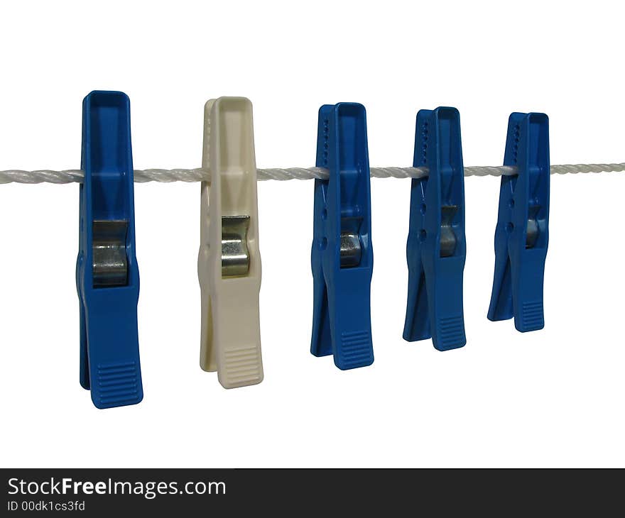 White clothespin among the blue ones on a clothes line, isolated on white. Contains clipping path. White clothespin among the blue ones on a clothes line, isolated on white. Contains clipping path.