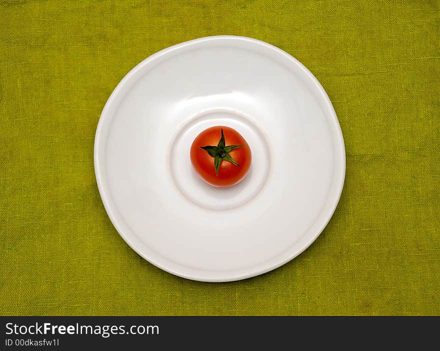 Cherry tomato on the white plate