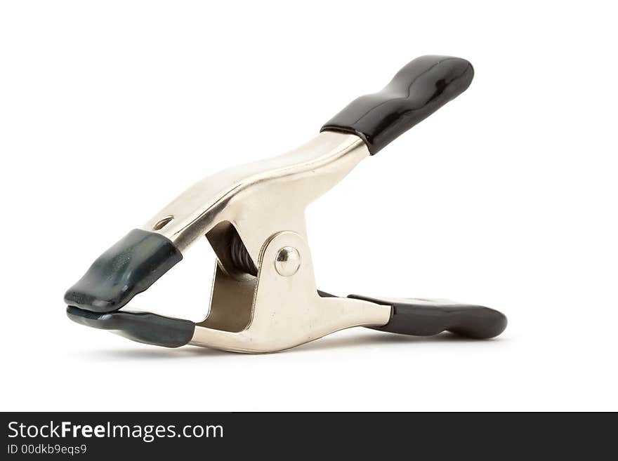 Metal clamp with black handles on white