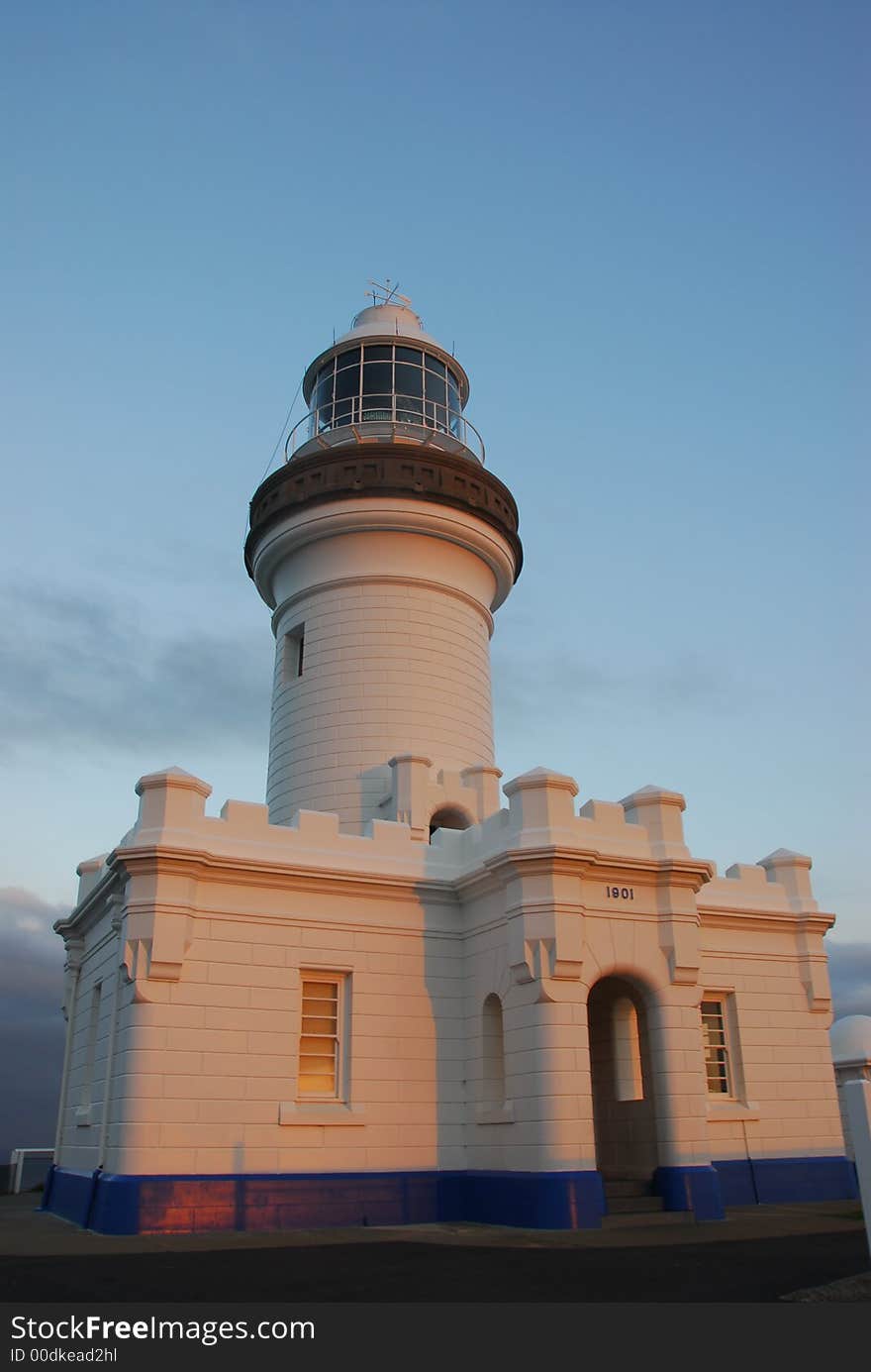 Lighthouse bathed in light from the setting sun at Byron Bay, Australia. Lighthouse bathed in light from the setting sun at Byron Bay, Australia