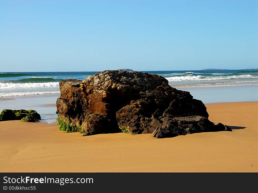 Large rock on an australian beach. Large rock on an australian beach