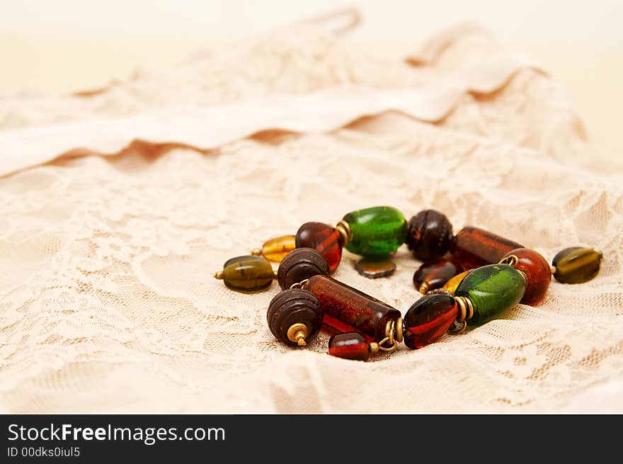 Green and brown bracelet lying