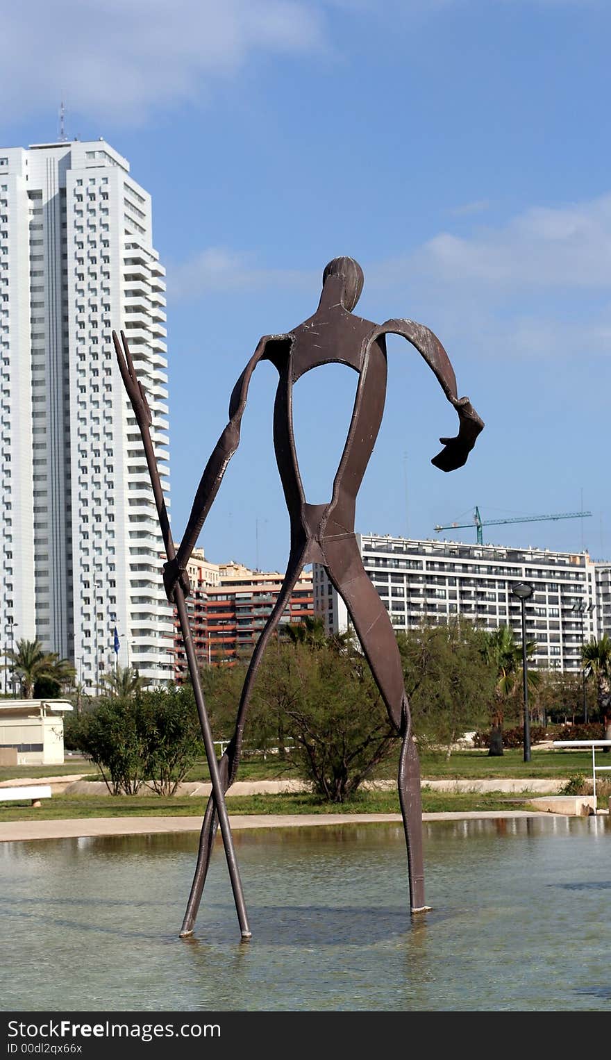 Building and statue reflected in pool of water. Building and statue reflected in pool of water