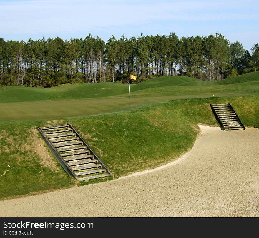 Steps leading out of a sand bunker on a golf course. Steps leading out of a sand bunker on a golf course