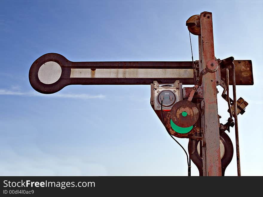 Old rusty train sign bevor blue sky