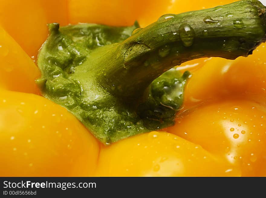 Macro of yellow pepper with drops of water