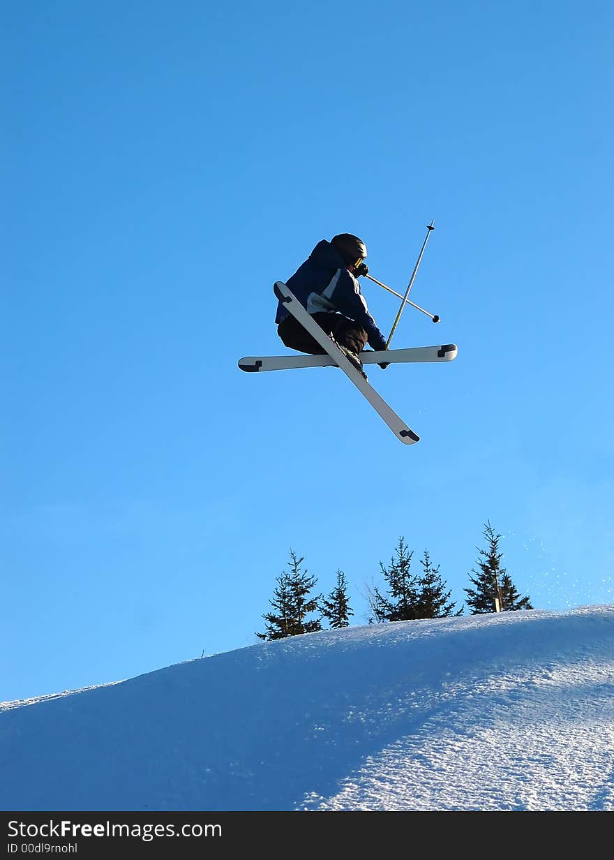 Airborn Skier on a blue background. Airborn Skier on a blue background