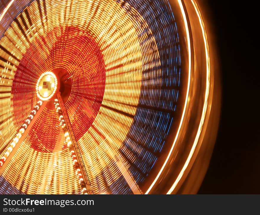 Nighttime blur of a ferris wheel. Nighttime blur of a ferris wheel