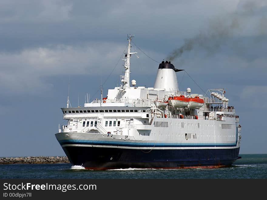 Cruise ship steaming into port. Cruise ship steaming into port