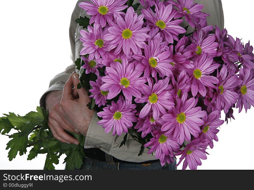 Man holding bouquet of flowers in his arms. Man holding bouquet of flowers in his arms