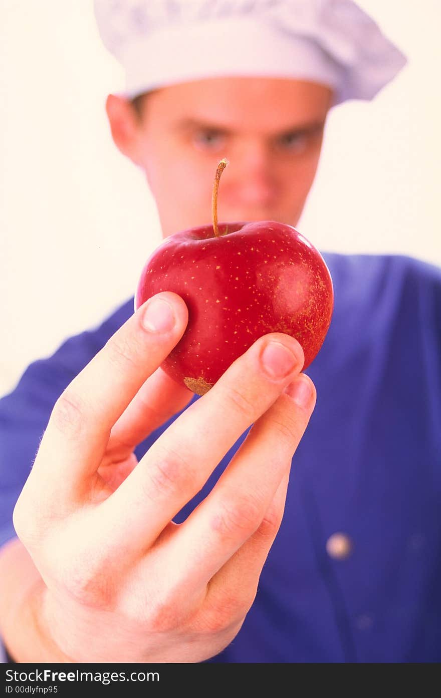 Red apple in a hand