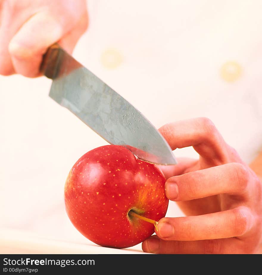 Cook cuts an apple