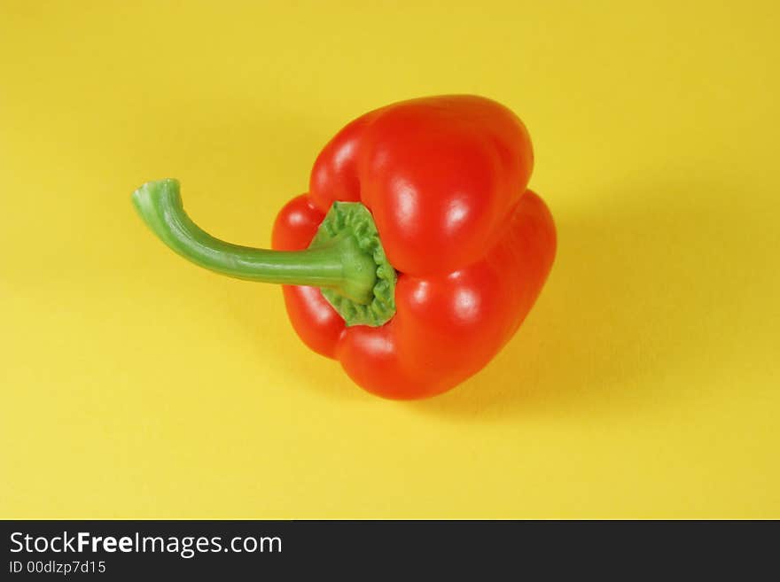 Red bell pepper on yellow