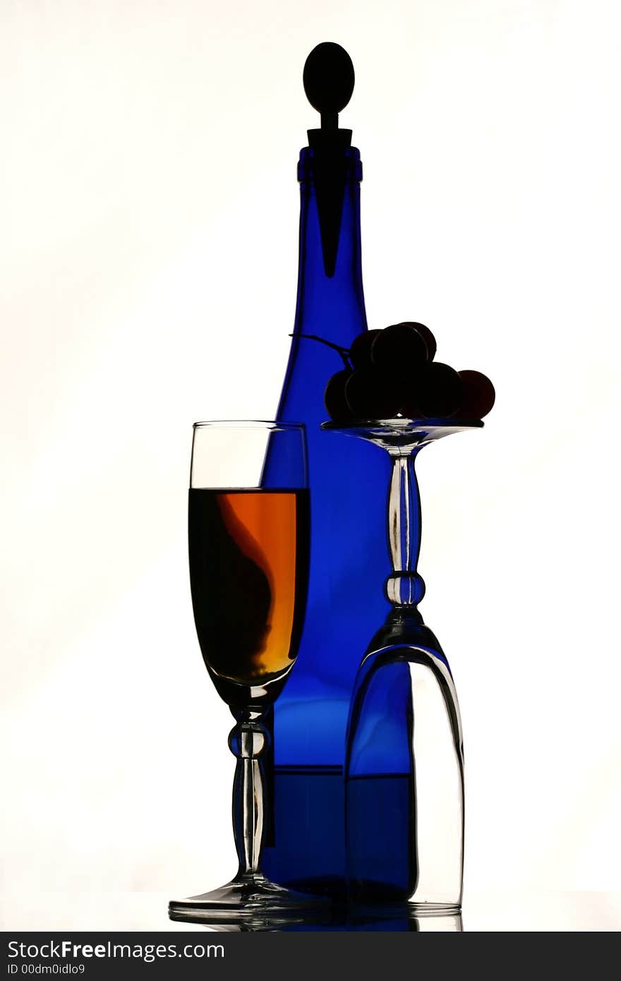 Blue bottle of wine, glasses a