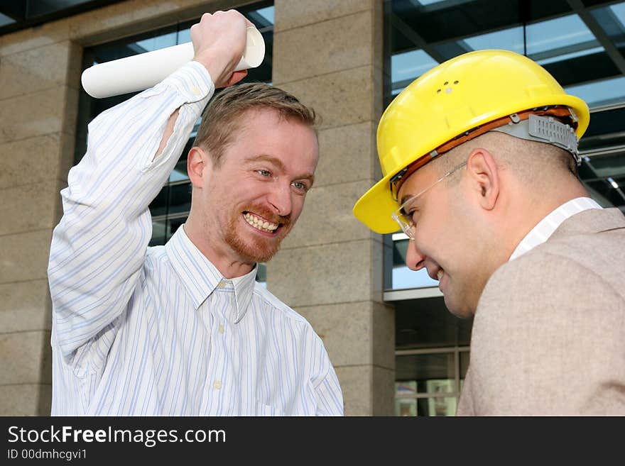 Angry architect and businessman with architectural plans