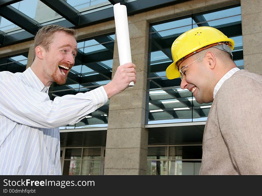 Angry architect and businessman with architectural plans