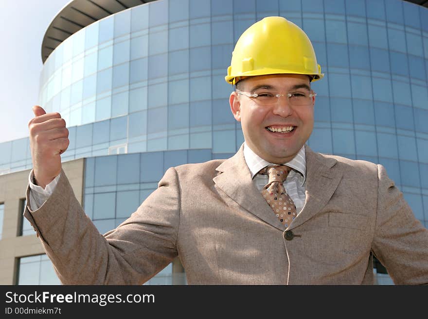 Successful an businessman with helmet. Successful an businessman with helmet