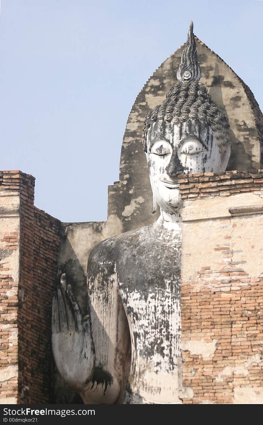 Ancient Stone Buddha Standing in Brick walls. Ancient Stone Buddha Standing in Brick walls