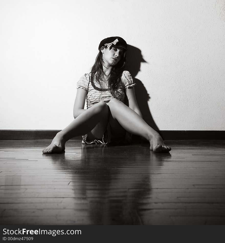 Loneliness: woman sitting on the floor crying